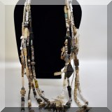 J119. Beaded multi-strand necklace with sterling bear charm. - $60